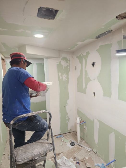 Worker drywall ladder