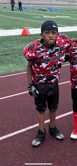 Young Panthers football player on game day